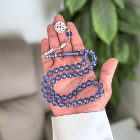 سبحة من بكلايت باللون البحري الشفاف