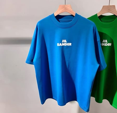 تيشيرت أزرق فضفاض بشعار جيل ساندر