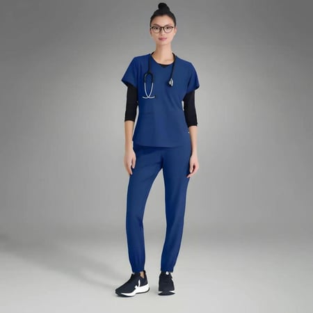 بلوزة سكراب من قريز اناتومي ايفولف رايثيم لون كحلي - lndigo