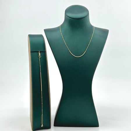 عقد و اسوارة ذهب اصفر عيار 18 من مجوهرات الشلوي