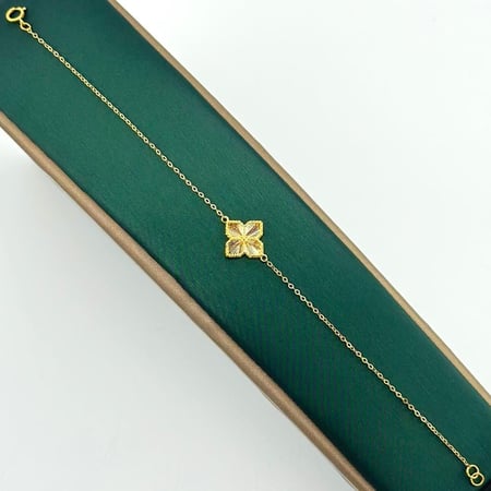 سوارة ذهب اصفر على شكل وردة عيار21 من مجوهرات الشلوي