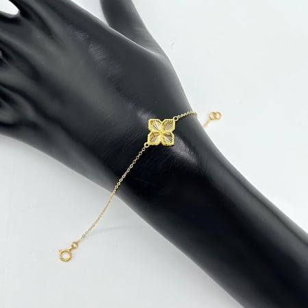 سوارة ذهب اصفر على شكل وردة عيار21 من مجوهرات الشلوي