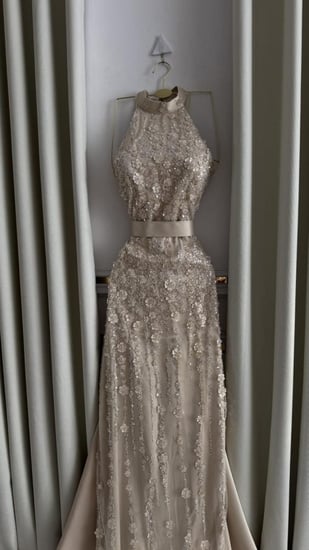 فستان سهرة شمبين طويل هالتر مطرز بالكامل بقصة واسعة فاخرة للسهرات الرا
