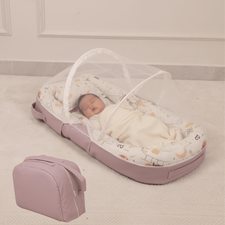 سرير مواليد محمول مع ناموسية وحقيبة تخزين لون وردي