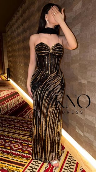 فستان بايري أسود ذهبي بتصميم كورسيه وتطريز شك يدوي وشال جورجيت