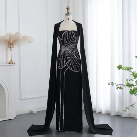 فستان أسود بتطريز فخم على شكل ورده وأكمام كيب