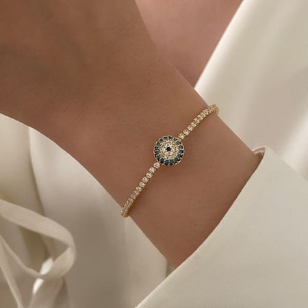 سوار مرصع بالزركون مع عين زرقاء مطلي ذهب.                    MB-110