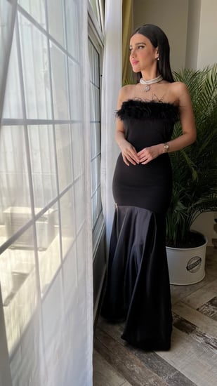 فستان سهره اسود سكيني مزين بالريش ومن الاسفل تفته