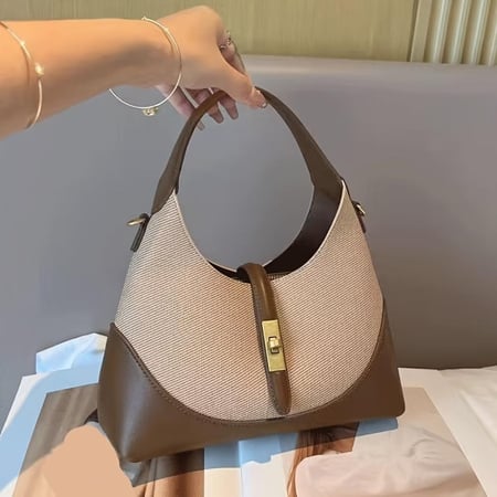 حقيبة كتف نسائية تتميز بدمج ألوان وتصميم هندسي فريد