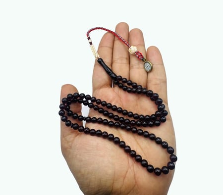 سبحة بكلايت نواعم 99 خرزه باللون بنفسجي شفاف بكركوشة الساعة