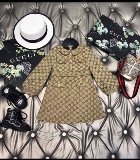 فستان قوتشي بأكمام طويله