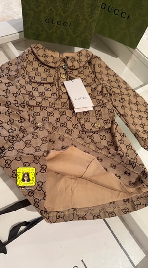 فستان قوتشي بأكمام طويله