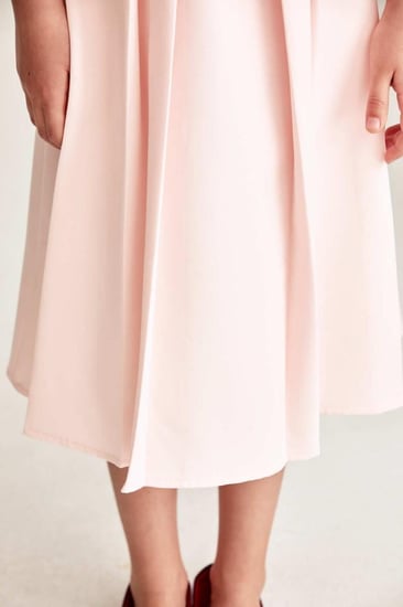 تنورة سادة بكسرات