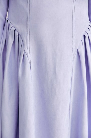 فستان بكسرات جانبية