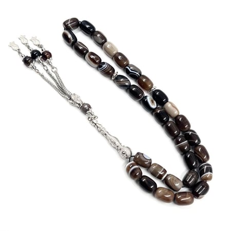 عرض مسطح لسبحة عقيق كبدي 33 خرزة بتدرجات داكنة