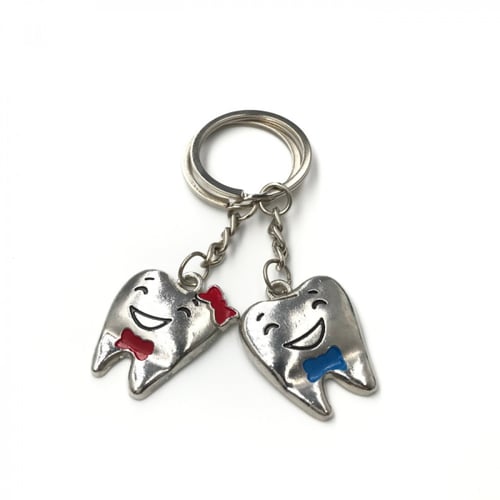 ميدالية مفاتيح معدنية على شكل سن