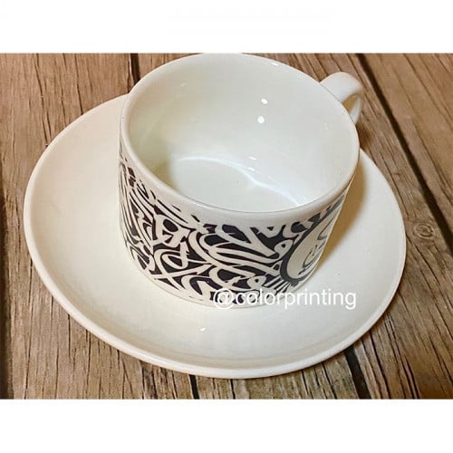 كوب ابيض مع صحن وملعقة