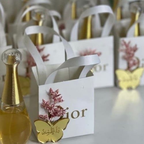 تنسيق عطر جادور ميني مع كيس ماركة ديور