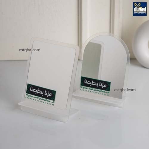 درزن (12 قطعة) توزيعات مرايات ستاند بشعار عزنا بطب...