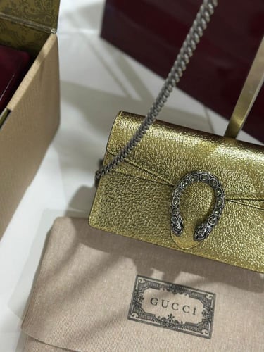 شنطة قوتشي ذهبي