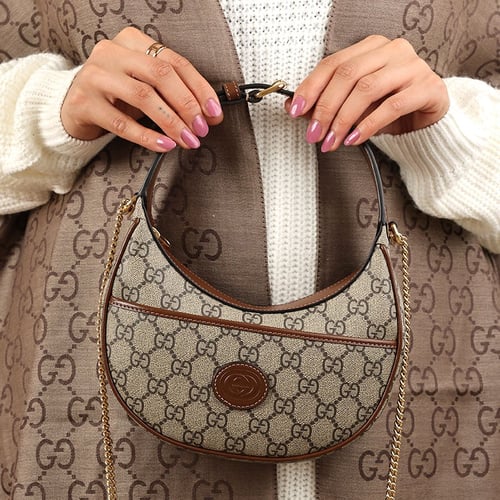 شنطة قوتشي لليد بني