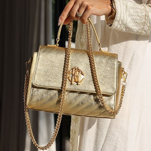 شنطة روبرتو كفالي ذهبية بالشعار