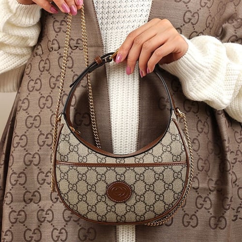 شنطة قوتشي لليد بني