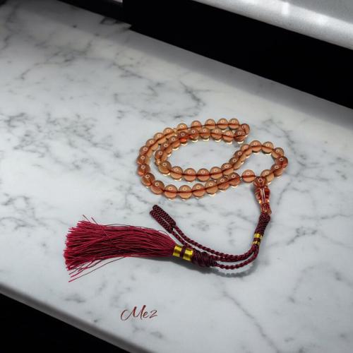 Iranian saffron rosary, transparent, luxurious color, sound and ring, and its scent with a luxurious fabric.