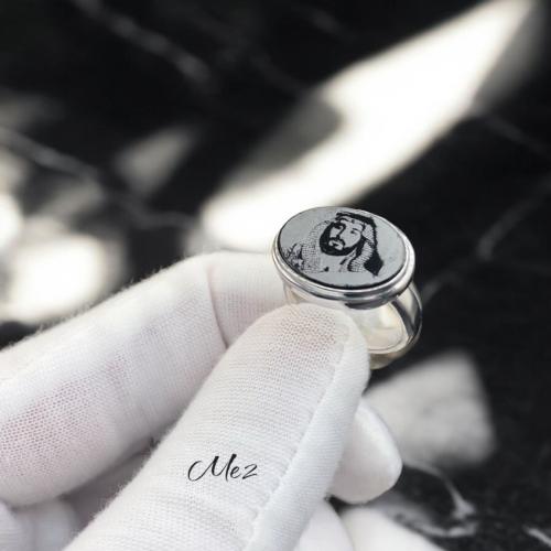 Royal ring with onyx stone and laser engraving of...
