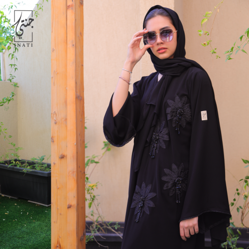Black abaya with half-moon fabric, decorated with large flowers and beads