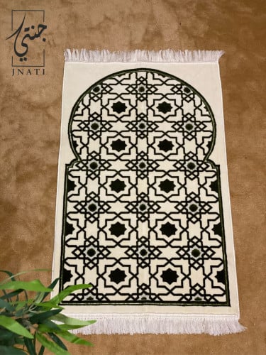 A patterned rug in green and beige.