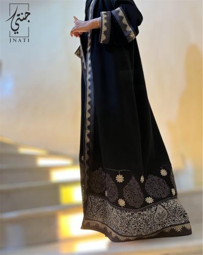 Black abaya made of half-moon fabric decorated with luxurious cane embroidery on the edges and sleeves