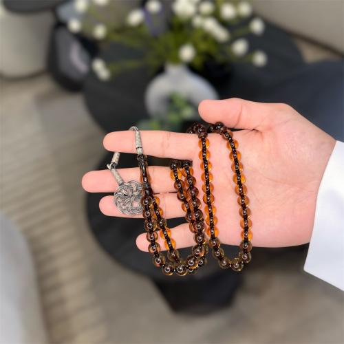 مسباح بكلايت ( عنابي بشفافيه )