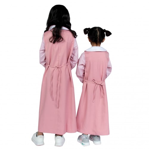 مريول إبتدائي زهري بتصميم كويتي من ذو الجناحين