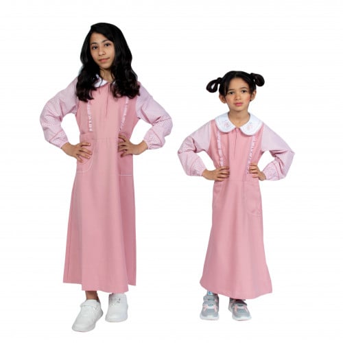 مريول إبتدائي زهري بتصميم كويتي من ذو الجناحين