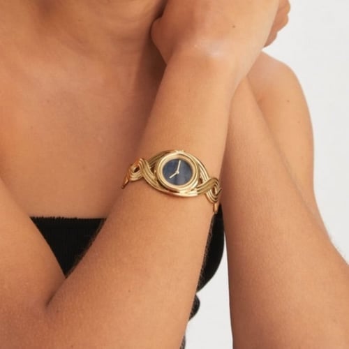 ساعة ميلر بسوار مجدول من توري بورش ذهبي