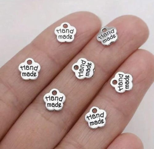 لوجو معدني بـ3 اشكال عشوائية 12 حبة