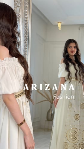 فستان ابيض مطرز ذهبي