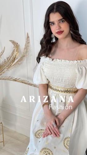 فستان ابيض مطرز ذهبي