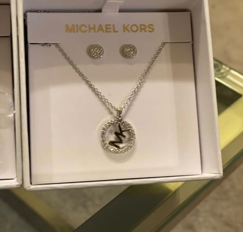 A set of earrings and a necklace from Michael, arr...
