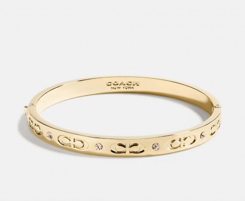 Coach Signature Hinged Bangle اسوره لون ذهبي من كو...