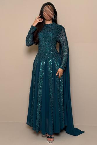 Long dark green dress with sequins and a back shawl.