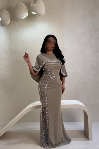 فستان زيتي مطرز بتفاصيل لؤلؤية مع جاكيت أنيق