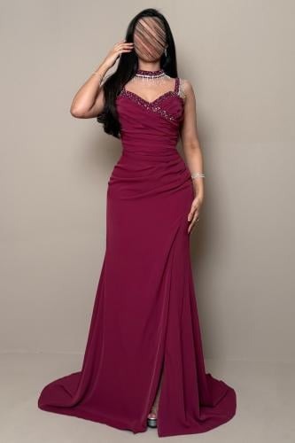Long fuchsia dress with soft pleats and bead embroidery by Mleha.