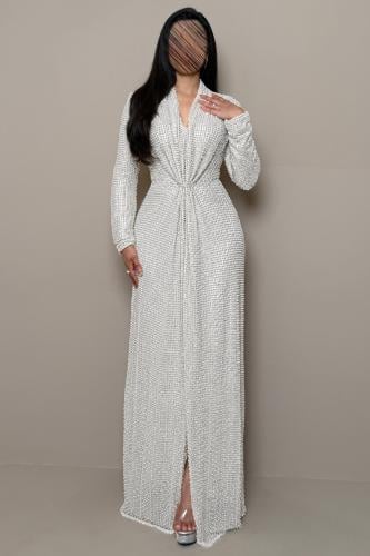 A long cream evening dress adorned with silver pearls.