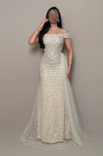 Light beige off-shoulder dress with shimmering sequin and bead embroidery.