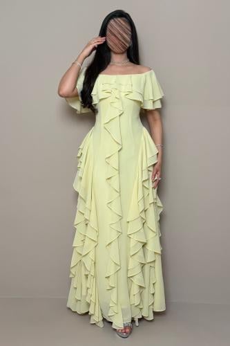 Long yellow off-shoulder dress with luxurious ruffle details by Mleha.
