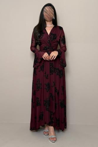 Long oud-colored dress with shimmering black floral details.