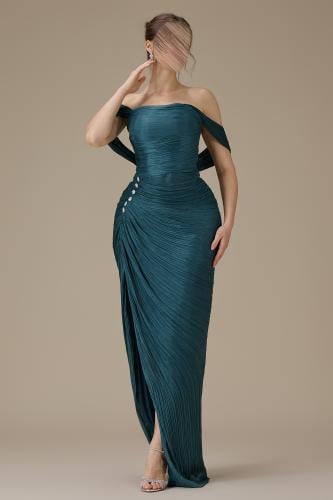 Long turquoise dress with flowing sleeves and pleated details.