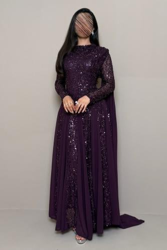 Long purple dress with sequins and a back shawl.